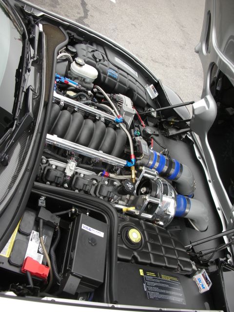 1998 Ford Crown Victoria - The engine bay features a supercharged V8 engine with custom blue hose clamps and intake piping.