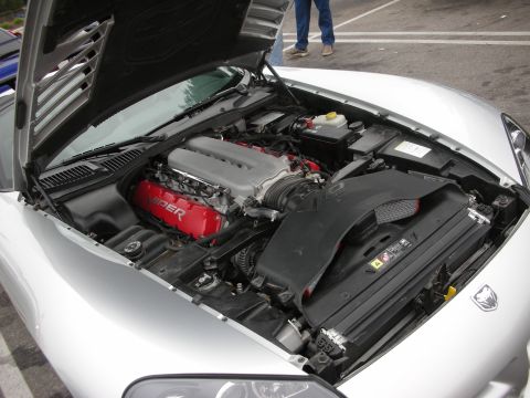 1998 Ford Crown Victoria - The engine bay of a silver car, red valve covers with 'Viper' branding and a prominent black air intake system.