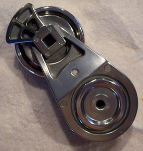 2002 Ford Mustang - This is a close-up view of a belt tensioner pulley, likely a replacement part.
