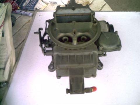 1964 Ford 427 - Holley carburetor, likely a performance part, shown on a white surface.