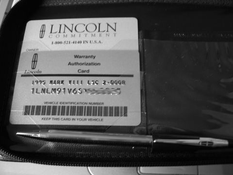1996 Mercury Grand Marquis - A Lincoln warranty authorization card from 1995 for a Mark VIII is shown with a pen.