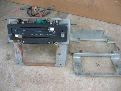 1992 Ford Mustang - A car's climate control unit is shown with its associated mounting brackets.