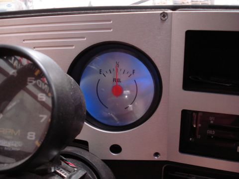 1979 Chevrolet C/K Pickup - Close-up of a vehicle's dashboard showing a fuel gauge and tachometer.