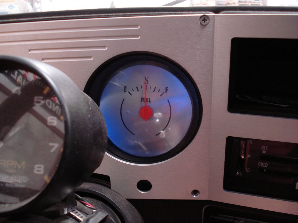 Fuel gauge and tachometer inside a vehicle