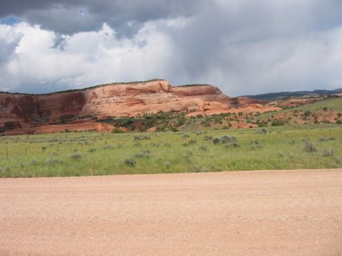 1997 Ford Ranger - Scenic view of desert landscape with red rock formations and a dirt road.