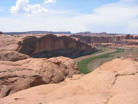 1997 Ford Ranger - A wide view of a desert canyon with a river flowing through it, under a partly cloudy sky.