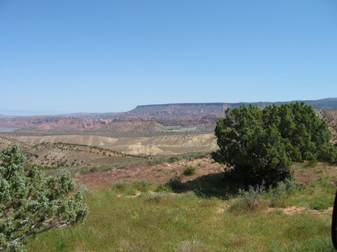 1997 Ford Ranger - Expansive desert scenery with layered rock formations under a bright blue sky.