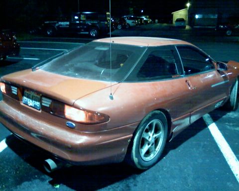 1993 Ford Probe - This 1993 Ford Probe GT is seen from the rear in a dimly lit parking lot.