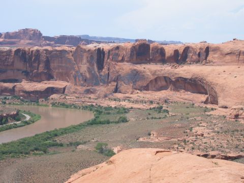 1997 Ford Ranger - A wide view of a desert canyon with a river winding through it, under a bright sky.