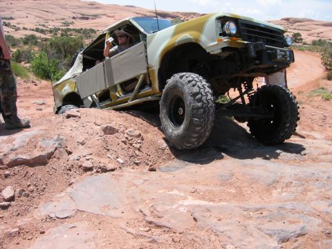 1997 Ford Ranger - A heavily modified truck navigates a challenging rocky trail, its off-road capabilities.