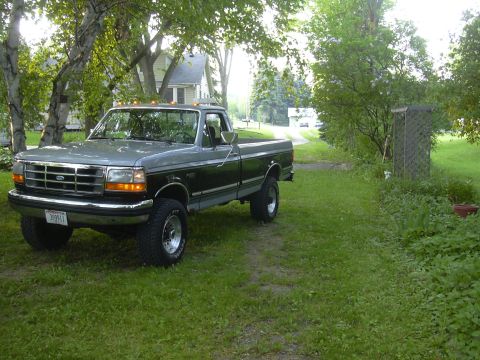 1992 Ford F-250 - This 1992 Ford F-250 is parked in a residential setting with a driveway leading away from the house.