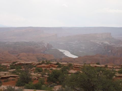 1997 Ford Ranger - A wide view of a desert canyon with a river, under an overcast sky.