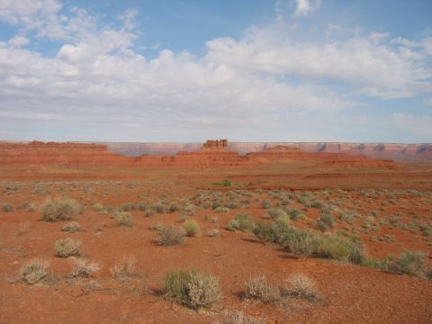 1997 Ford Ranger - A wide view of a desert landscape with mesas and buttes under a partly cloudy sky.