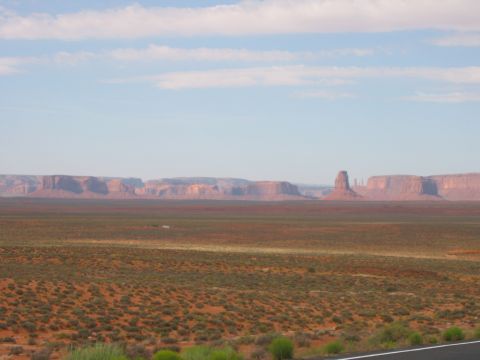 1997 Ford Ranger - A vast desert landscape with iconic rock formations under a partly cloudy sky.
