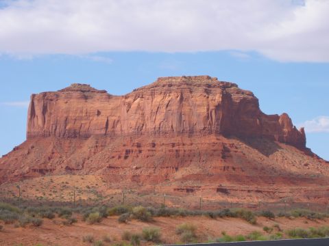 1997 Ford Ranger - The iconic red rock formations of Monument Valley stand tall against a bright blue sky.