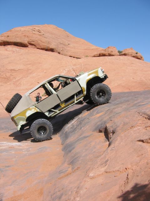 1997 Ford Ranger - This heavily modified off-road vehicle navigates a challenging rocky terrain.