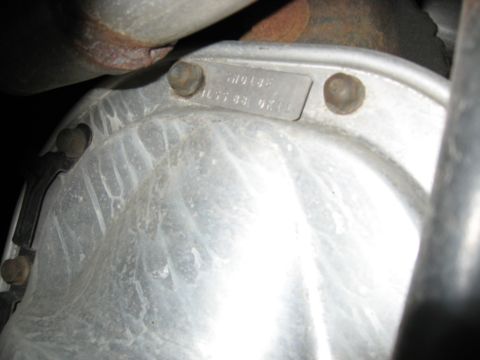 2001 Ford Crown Victoria - Close-up of a vehicle's differential housing, showing stamped identification numbers.