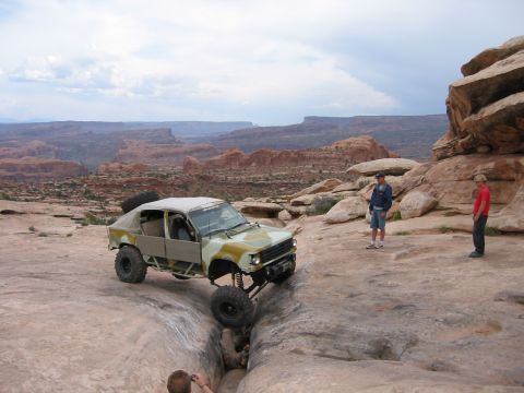 1997 Ford Ranger - Custom off-road vehicle navigating challenging terrain in a desert canyon.