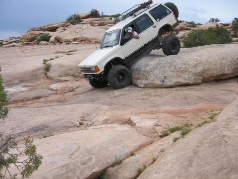 1997 Ford Ranger - Modified 1997 Ford Ranger navigating a rocky trail during an off-road excursion.