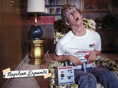 1991 Ford Bronco - A man sits in a chair with a device attached to his head and lap, with the name "Napoleon Dynamite" visible.