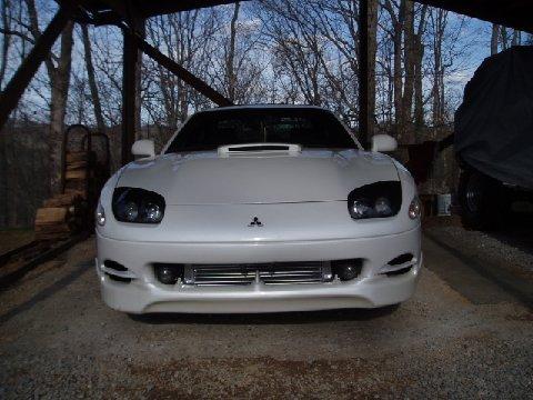 1994 Dodge Stealth - Front view of a white 1994 Dodge Stealth R/T Twin Turbo, showing its distinctive headlights and grille.