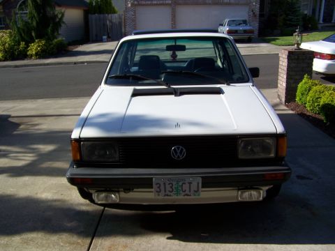 1984 Volkswagen Jetta - The front of a white Volkswagen Golf Mk2 is shown parked in a driveway.