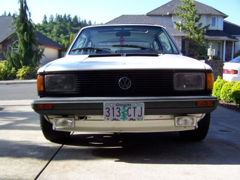 1984 Volkswagen Jetta - The front of a white 1984 Volkswagen Jetta is shown parked in a driveway.
