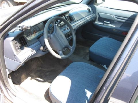 2003 Ford Crown Victoria - Interior of a 2003 Ford Crown Victoria, showing the dashboard and seats.