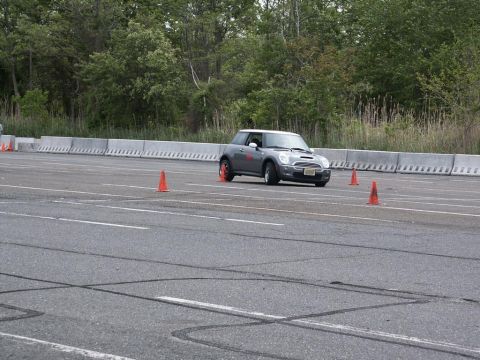 2001 Mercury Grand Marquis - A gray Mini Cooper navigates an autocross course marked by orange cones.