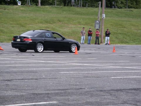 2001 Mercury Grand Marquis - A black sedan navigates an autocross course with orange cones marking the path.