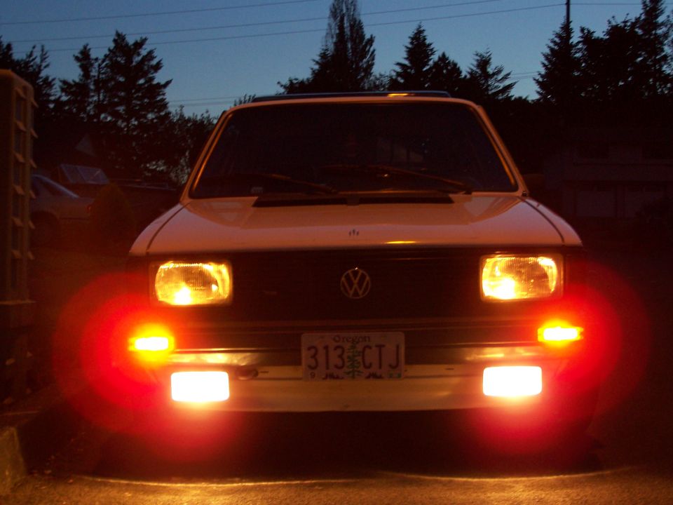 White 1984 Volkswagen Jetta front view with headlights and parking lights illuminated
