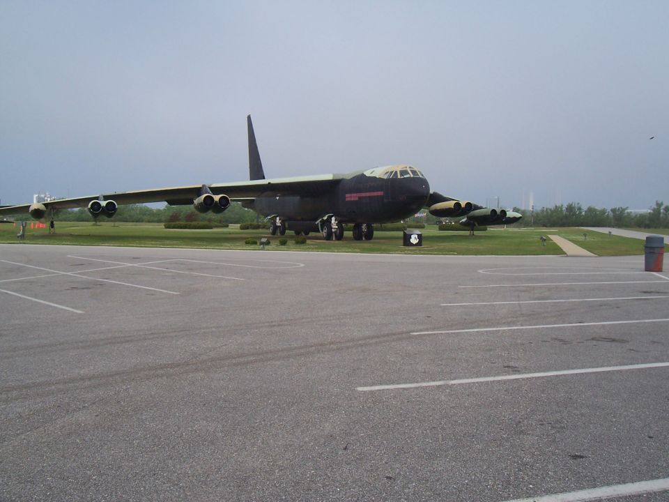Bomber airplane on display with another aircraft in the background