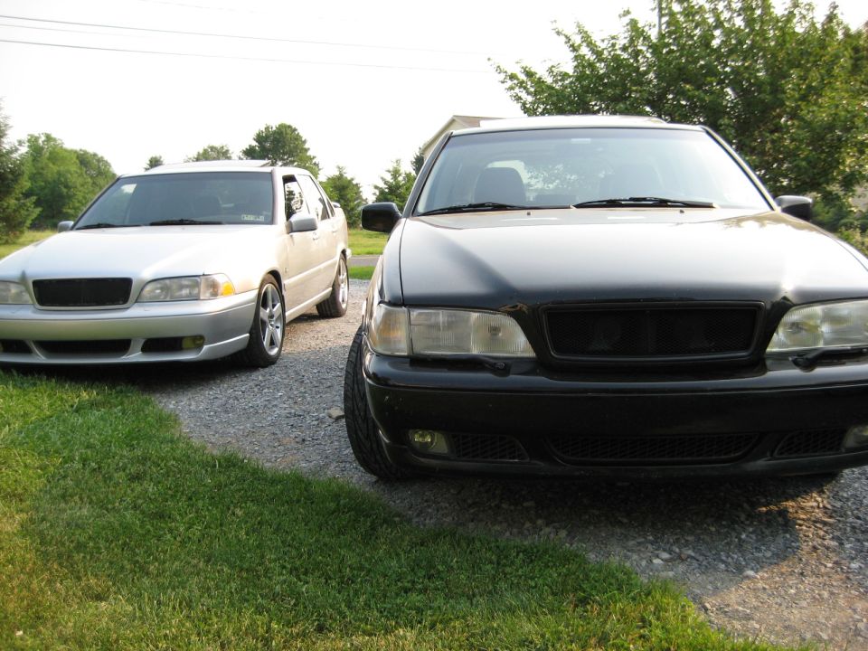 Front view of black Volvo sedan and silver Volvo sedan parked side-by-side