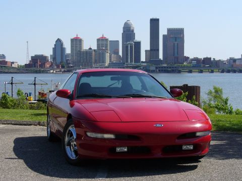 1991 Ford Probe - 1991 Ford Probe in front of a city skyline.