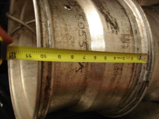 Wheel measured with tape measure showing approximately 10.5 inches