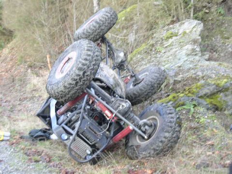 1979 Ford Bronco - This off-road buggy has rolled over on a rocky, wooded incline.