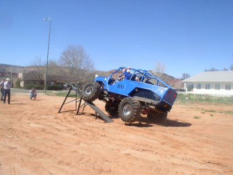 1979 Ford Bronco - A custom-built buggy navigates an obstacle course on a sunny day.