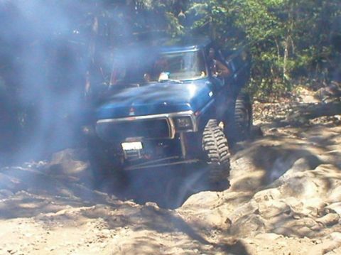 1979 Ford Bronco - This 1979 Ford Bronco is tackling a challenging, rocky terrain with a plume of smoke obscuring the front.