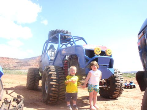 1979 Ford Bronco - Children pose with a custom off-road buggy in a desert landscape.