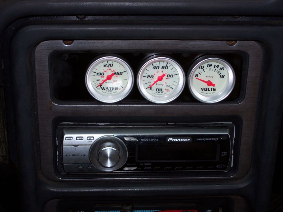 Dashboard with three gauges (water, oil, volts) and a Pioneer stereo