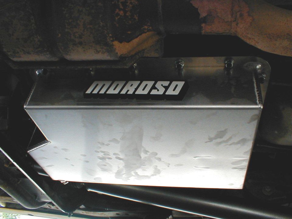 Moroso oil pan shield mounted under a vehicle, showing some water spots