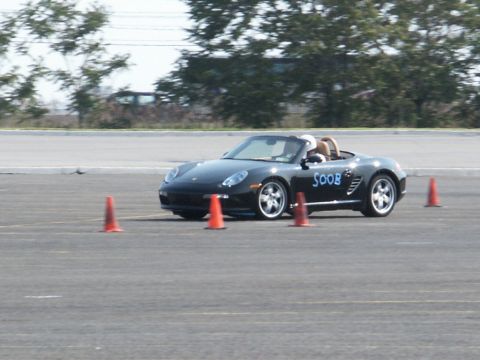 2001 Mercury Grand Marquis - Black convertible sports car with 'SOOB' text on the side, navigating an autocross course.