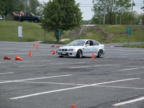 2001 Mercury Grand Marquis - Silver BMW M3 coupe on a race track, with a pickup truck in the background.