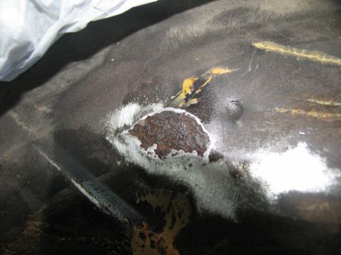 1978 Ford Bronco - Close-up of a corroded metal surface, possibly from a vehicle's undercarriage.