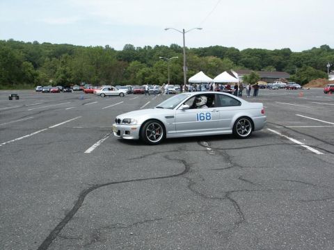 2001 Mercury Grand Marquis - Silver coupe with racing number 168 on door participates in an autocross event.