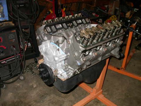 1990 Ford Bronco - V8 engine on an engine stand, likely undergoing rebuild or modification.