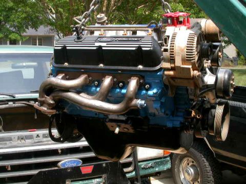 1990 Ford Bronco - A Ford V8 engine, likely out of a truck, is being worked on outside.