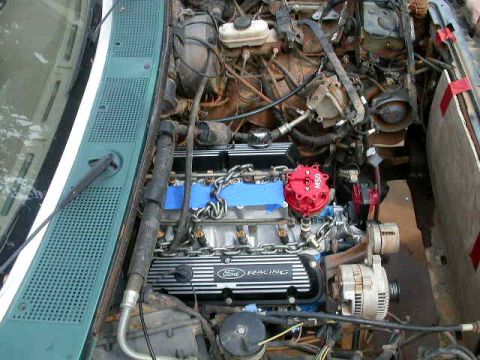 1990 Ford Bronco - Close-up view of a Ford engine, showing the valve covers and ignition system.