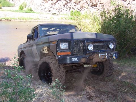 1981 Ford F-150 - This 1981 Ford F-150 is shown navigating a muddy off-road terrain.