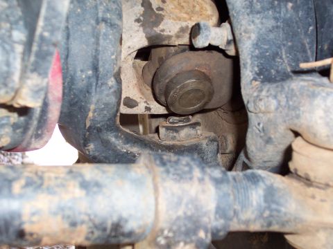 1981 Ford F-150 - This image shows a close-up view of a vehicle's suspension system, focusing on mechanical components.